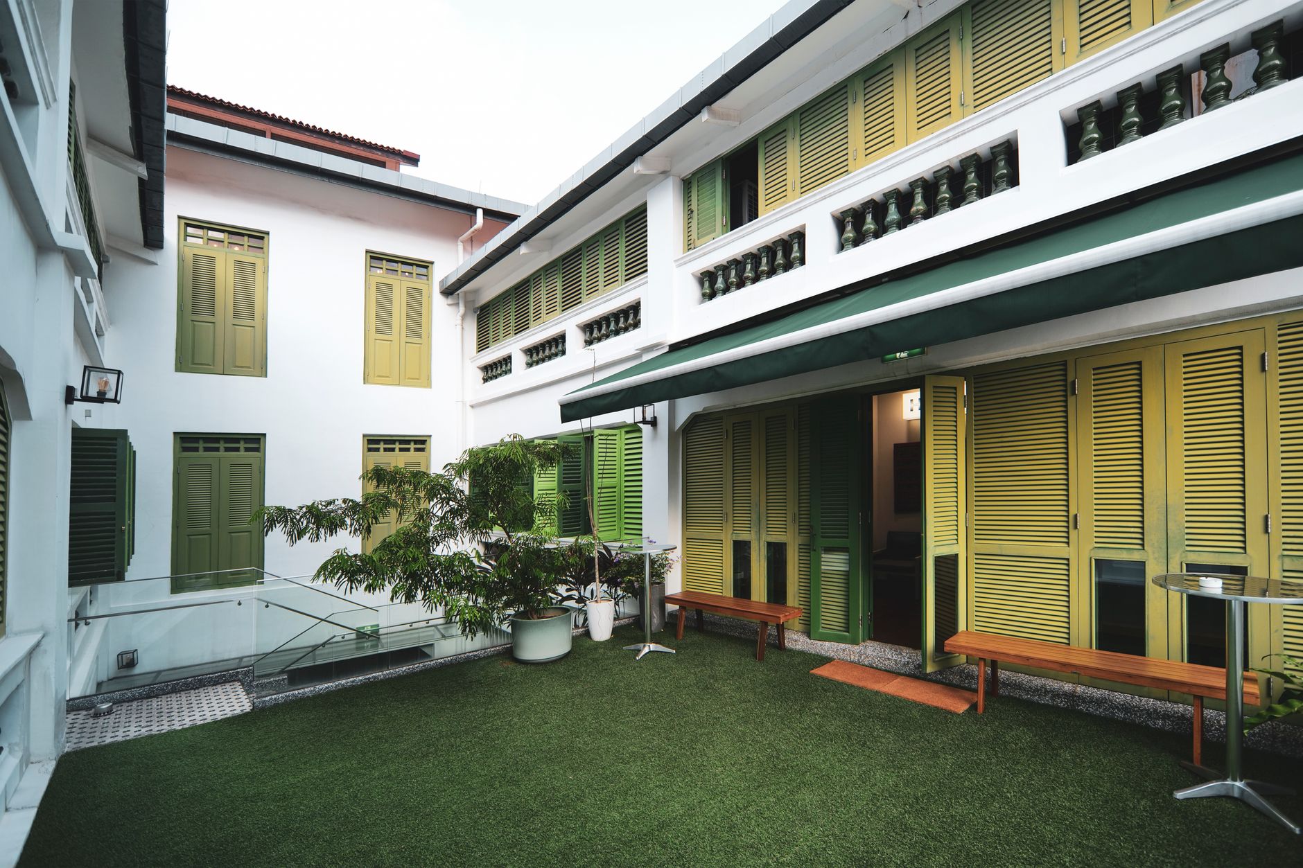 The Staybook guest house courtyard glowing at dusk